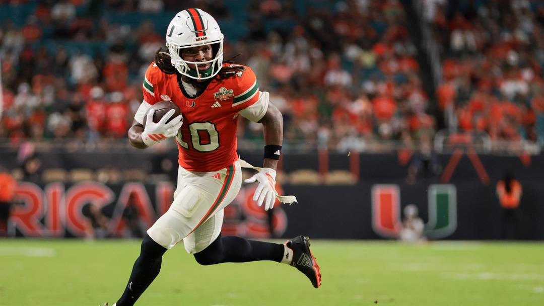 Nov 15, 2025; Miami Gardens, Florida, USA; Miami Hurricanes wide receiver Malachi Toney (10) carries the football for a touchdown against NC State Wolfpack during the fourth quarter at Hard Rock Stadium. Mandatory Credit: Sam Navarro-Imagn Images
